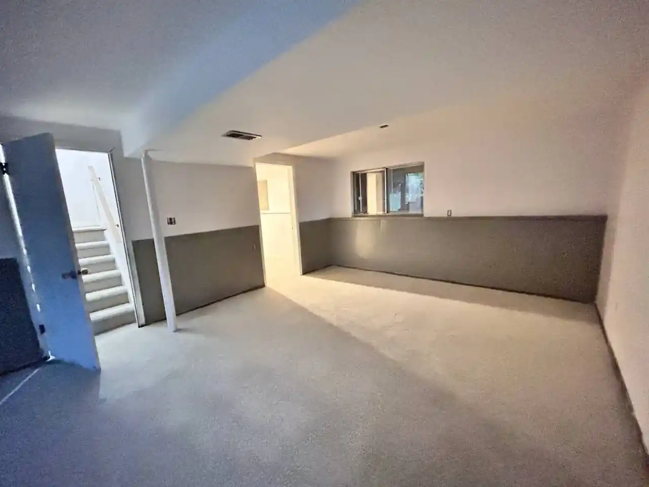 Interior painting project in Denver hallway with freshly painted walls and ceiling