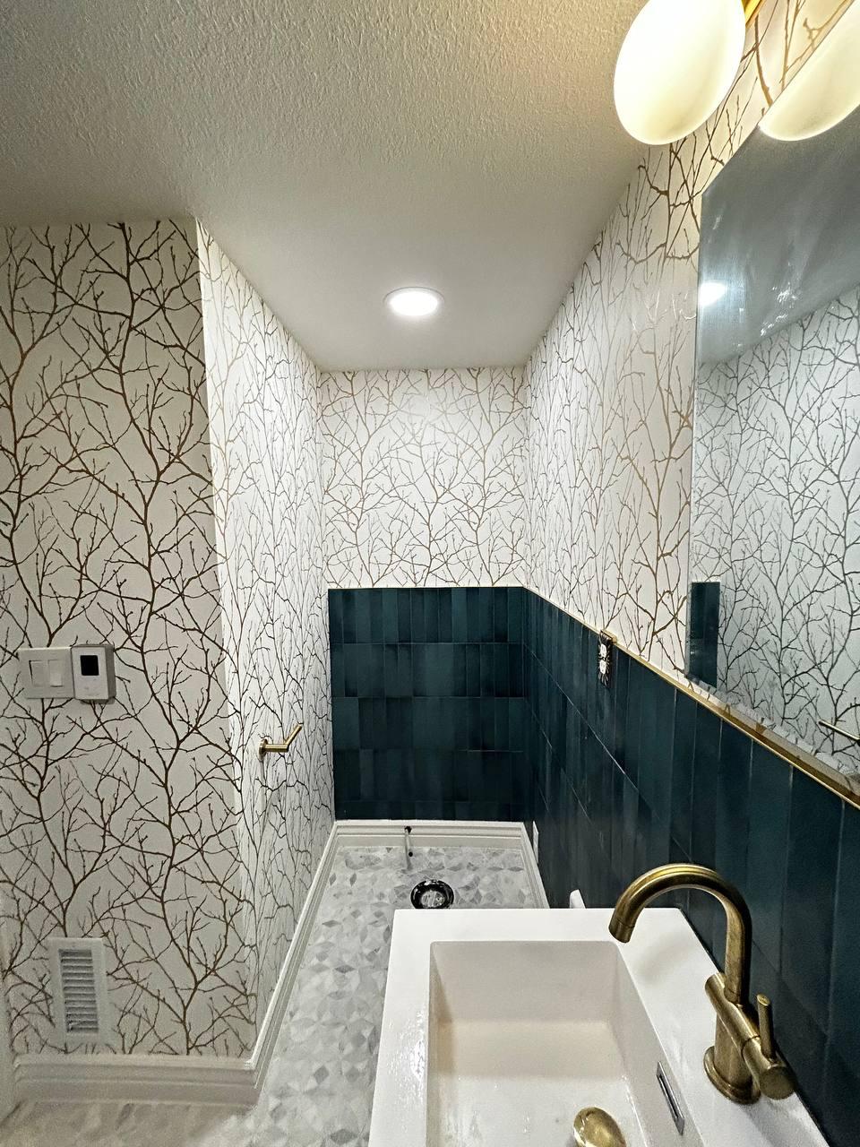 Bathroom wallpaper installation with modern tile and fixtures