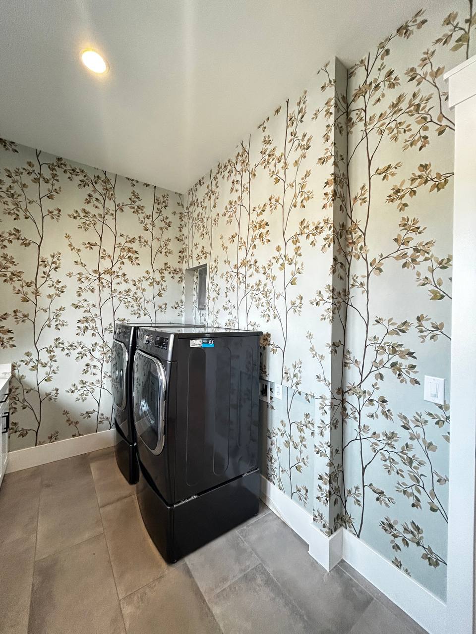 Interior wall finished with professionally installed decorative wallpaper